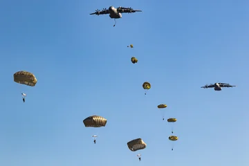 Military tactical transport air force aircraft drop paratroopers  © VanderWolf Images