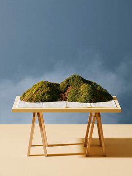 Paper map with soil and grass ridges rising from the page, resting on a cream trestle table with ample copy space for risk management concepts