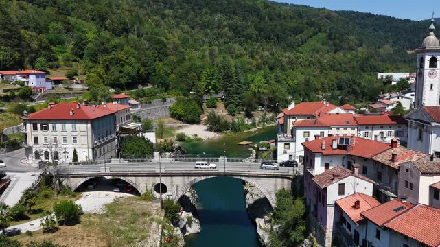 Aerial view of the Isonzo (Soča) River in Slovenia: the village of Kanal, the stone arch bridge (Most Kanal).
Kanal is a typical Slovenian mountain village.