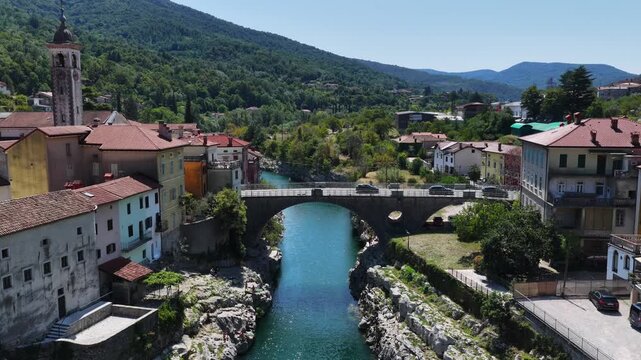 Aerial view of the Isonzo (Soča) River in Slovenia: the village of Kanal, the stone arch bridge (Most Kanal).
Kanal is a typical Slovenian mountain village.