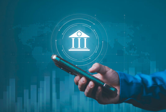 Banking, Economic, digital finance, financial services, technology and connectivity. Global banking, finance, smartphone with a digital bank icon, world map and financial data.