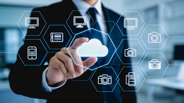 Businessman touching cloud computing interface with connected devices