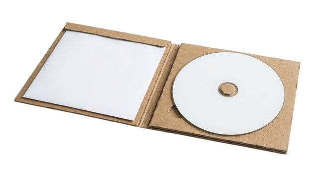 Open cardboard CD case with white disc isolated on transparent