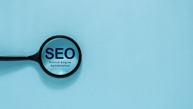 SEO Search Engine Optimization Concept with Magnifying Glass for Website Visibility, Online Search Ranking and Digital Marketing Strategy