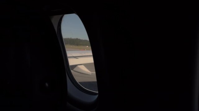 Static View From Airplane Window Over Runway