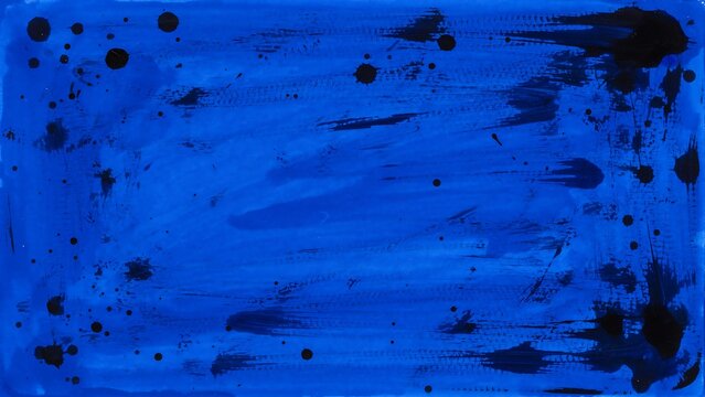 Abstract background with blue paint wash and black ink splatters and drips on surface