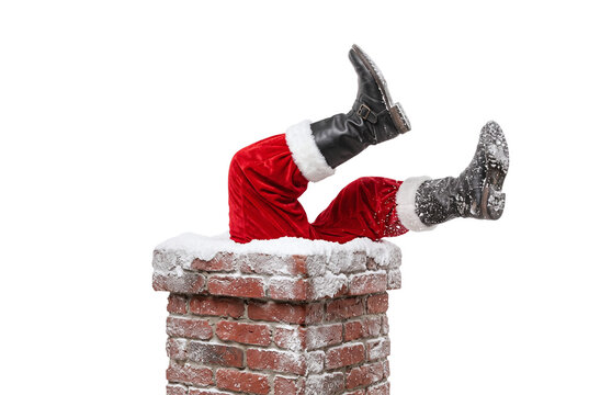 Santa claus legs sticking out of brick chimney