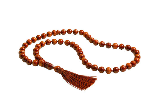 Polished wooden Islamic prayer beads (Misbaha) with tassel against white background