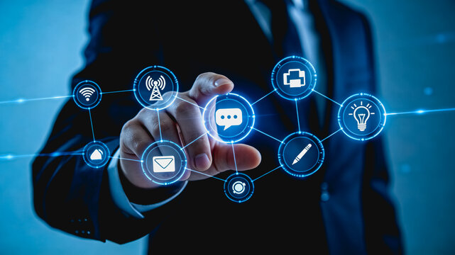 Businessman Interacting with Digital Networked Communication Icons