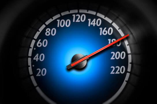 A car speedometer shows a red needle pointing to high speed against a glowing blue center.