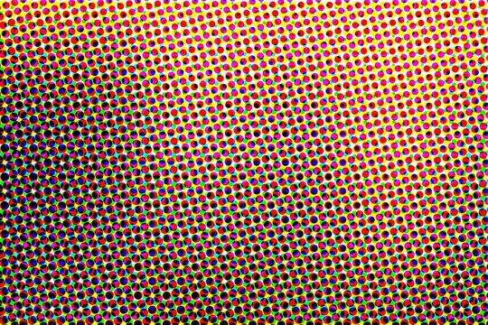 Colorful CMYK halftone pattern with overlapping dots provides a professional retro print effect for media layouts