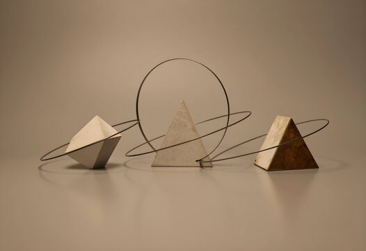 Minimalist design and abstract geometry, stone pyramids and metal rings for modern architecture and interior decor concepts on a neutral background