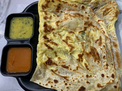 Traditional Malaysian Indian-Style Roti Telur with Egg Filling