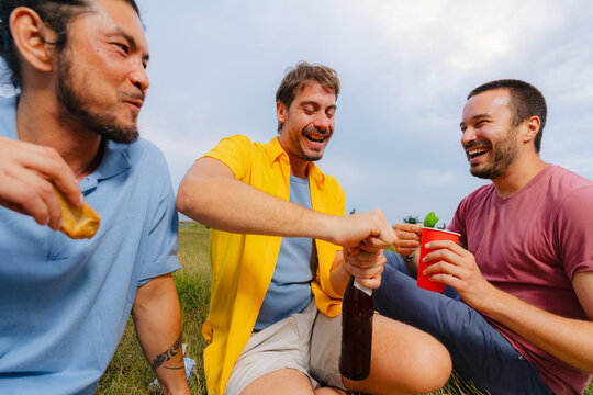 Friends Laughing at Outdoor Picnic