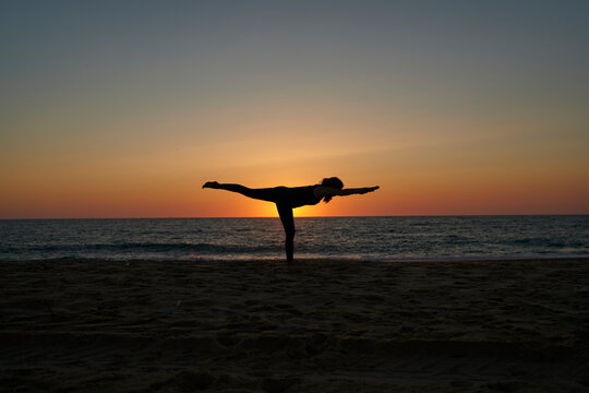 Yoga Silhouette on the Beach at Sunset