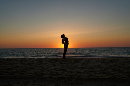 Yoga Silhouette on the Beach at Sunset