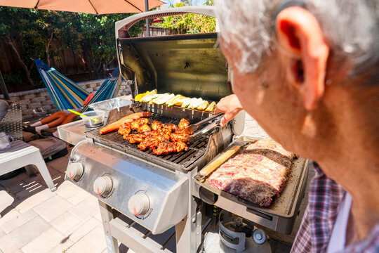 summer lifestyle backyard bbq grilling chicken family get together