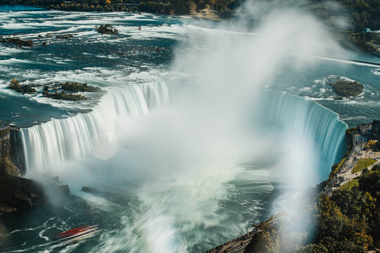 Niagara Falls waterfall cascading over rocky cliff edge with powerful flowing water motion