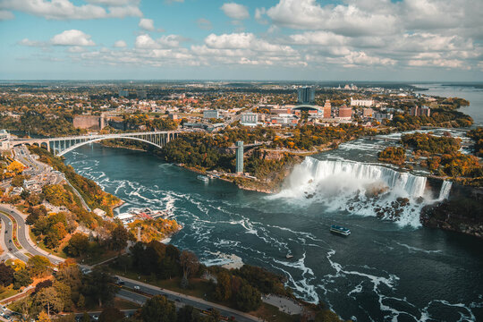 Niagara Falls waterfall cascading over rocky cliff edge with powerful flowing water motion
