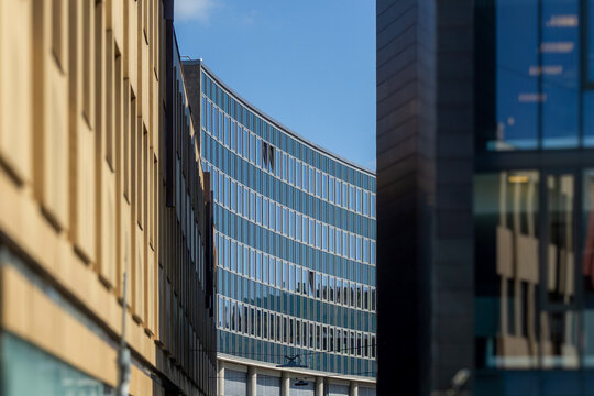 Fredrikstad modern curved glass building facade against blue sky