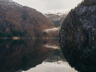 Scenic view of Norwegian fjord with mountain reflection in calm water © Olga