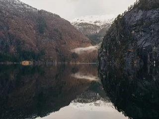 Scenic view of Norwegian fjord with mountain reflection in calm water © Olga