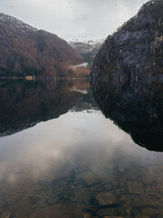 Scenic view of Norwegian fjord with mountain reflection in calm water © Olga