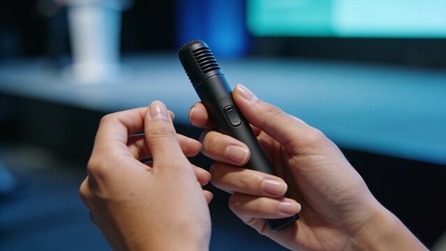 Generative AI captures a person holding a wireless microphone during a presentation