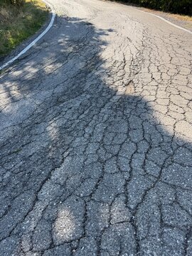 Closeup image of cracks in the road