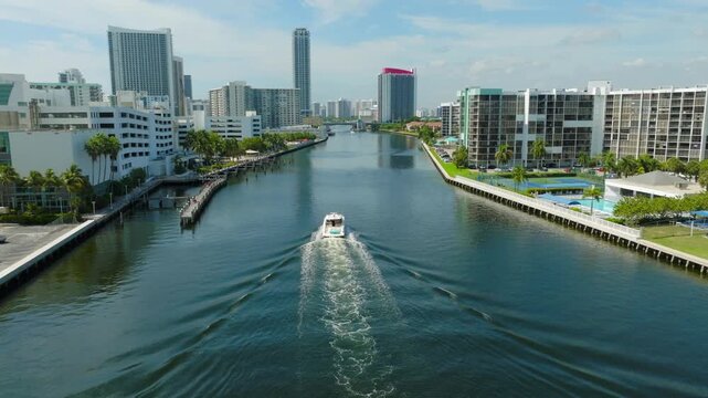 Aerial View of Boat Traveling Through Hollywood Beach Waterway with Florida Waterfront Skyline