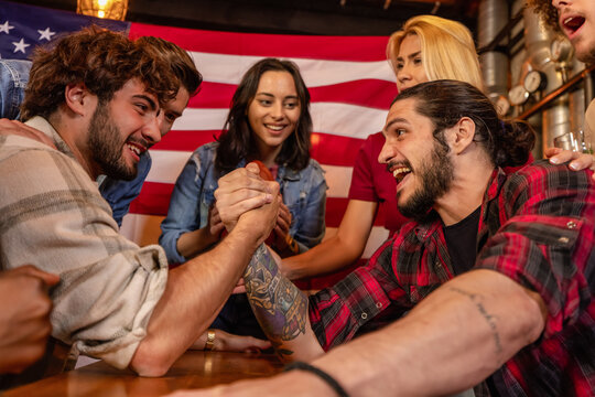 Excited Friends Reacting to Arm Wrestling Match