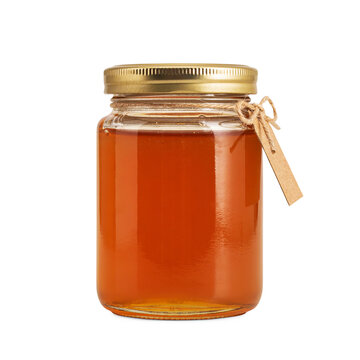 Glass jar of golden honey with a rustic paper tag isolated on a transparent background