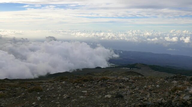 Sunset view above the clouds from Kalahaku Overlook in Haleakalā National Park, on the Haleakala volcano, on the island of Maui, Hawaii. Looking north. Also known as the East Maui Volcano.