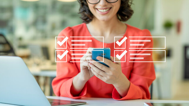 Smiling woman using smartphone with digital checklist in a professional office setting
