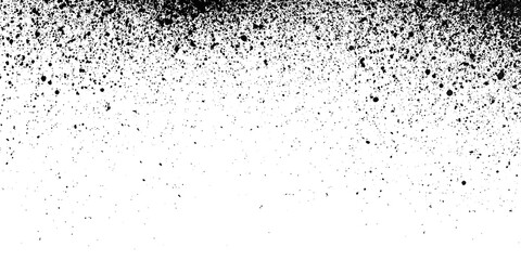 Obraz premium Black and white grunge texture with spray paint splatter effect and grainy noise overlay.