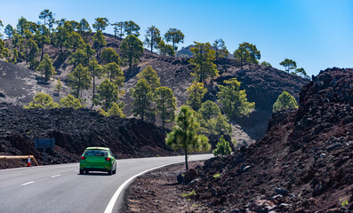 Obraz premium Tenerife travel reveals volcanic scenery. Tenerife mountain landscape frames scenic highway. Rugged Tenerife geology enriches adventure. Tenerife destination rewards exploration.