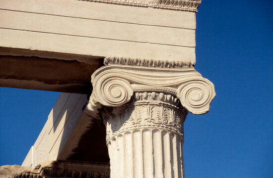 Detailed view of classical Ionic order capital with egg-and-dart carving at Erechtheion temple, Athens