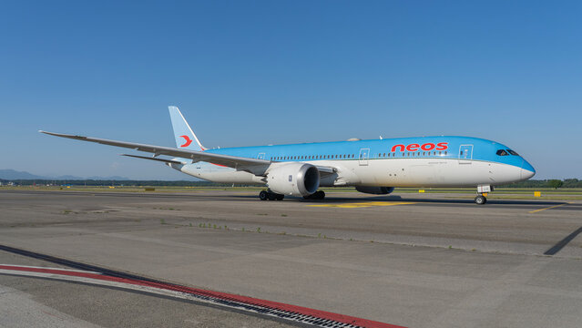 A Neos Boeing 787 Dreamliner is taxiing to the runway at MXP Milano Malpensa international airport