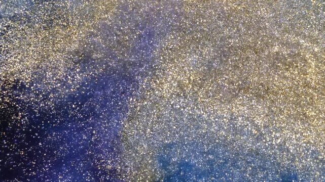 Mixing alcohol ink fragments in a clear container during a creative session