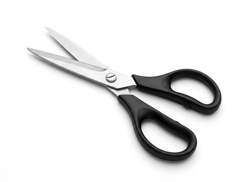 Black handled scissors open on plain background isolated on white background