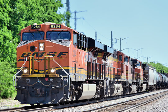 A quartet of front-end locomotives power a westbound Burlington Northern Santa Fe merchandise freight train through northern Illinois.