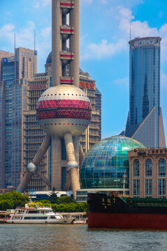  A cargo boat crossing the Hangpu river in front of the Pudong skyline featuring Oriental Pearl Tower, Bank of Shanghai headoffice and sourrounding modern skyscrapers, Shanghai, China 31 July 2026