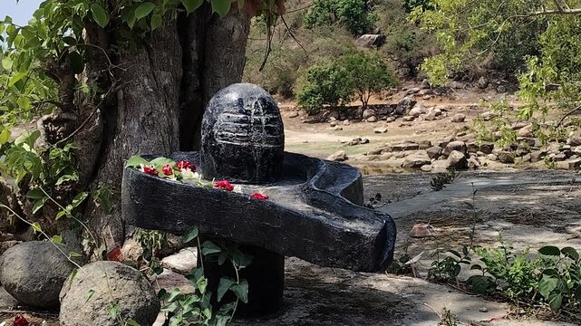 Small Sacred Shiva Lingam Shrine with Flowers