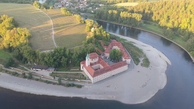 Picturesque aerial view of the historic Weltenburg Abbey, a Benedictine monastery nestled in a scenic bend of the Danube River in Bavaria