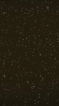 Animation of snow falling with copy space over black background
