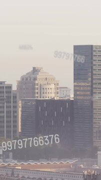 Animation of numbers and data processing over cityscape