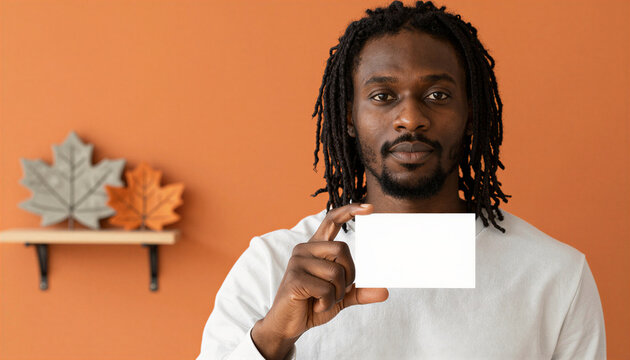 African American man holding blank white business card