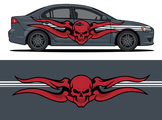 Fototapeta premium Grey car with red skull and flame decal wrap