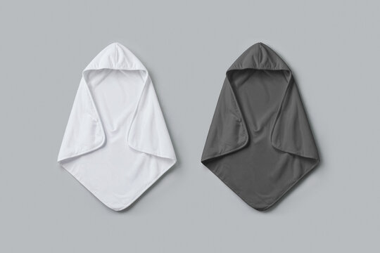 Black and white baby hooded towel on grey background, ai generated. Clean fabric absorb mockup copy space for infant or toddler bathing everyday hygiene, parenting or nursery products.