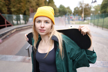 Stylish woman with skateboard in skate park © New Africa